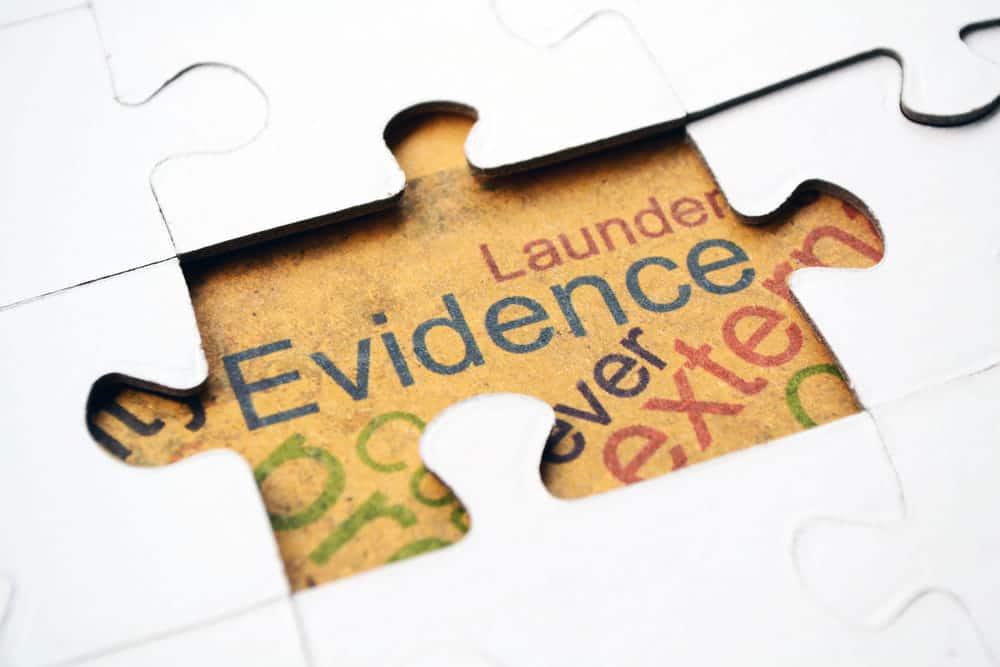 Image is of puzzle pieces forming the word evidence, representing how different elements come together to support sexual assault claims