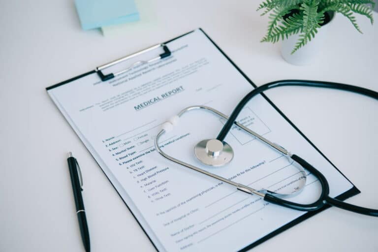 Image is of a medical report with a stethoscope placed on top, showing how medical documentation supports sexual assault claims in legal cases