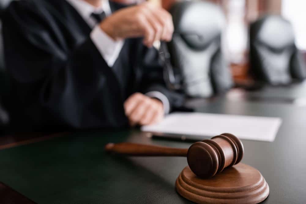 Image is of a courtroom gavel placed before a judge during legal proceedings, concept of a mass tort case going to trial in Washington, D.C.