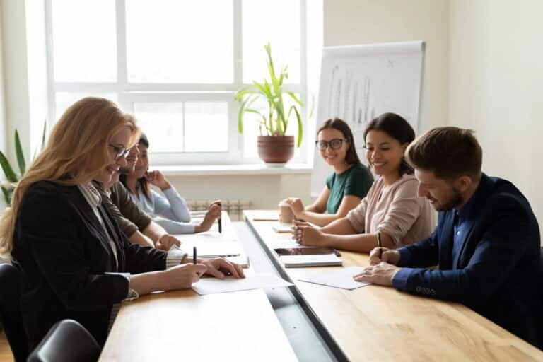 Image is of employees meeting together in an office conference room, concept of collective bargaining discussions in Tennessee workplaces.