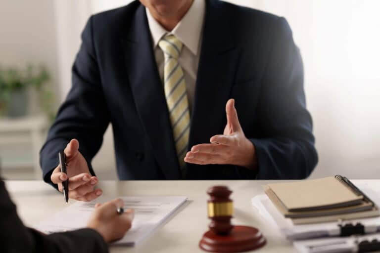Image is of an attorney discussing a legal matter with a client, concept of sexual assault in D.C.